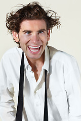 Image showing Crazy, insane and face of man on a white background with stress, crossed eyes and madness. Mental health, anxiety and professional male worker with burnout, stressed out and messy hair in studio