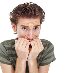 Image showing Man, nervous and biting nails in studio portrait for mental health, fear or worry by white background. Male student, young guy or scared with stress, anxiety or problem with mistake, confused or fail