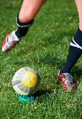 Image showing Rugby kick, feet and man with a sports ball outdoor on a pitch for action, goal or score. Male athlete person playing in sport competition, game or start training for fitness, workout or exercise