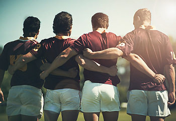 Image showing Rugby team, sports and men together outdoor on a pitch for scrum, hug or huddle. Male athlete group playing in sport competition, game or training match for fitness, workout or teamwork exercise
