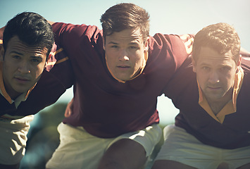 Image showing Rugby team, portrait and sports men together outdoor on a pitch for scrum, hug or teamwork. Male athlete group playing in sport competition, game or training match for fitness, workout or exercise