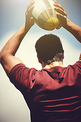 Image showing Rugby ball, sports and man outdoor to play a game, throw and score a goal. Headshot of a male athlete person playing in sport competition or training for fitness, workout or exercise from behind