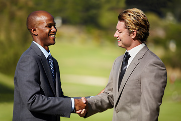 Image showing Happy business men, shaking hands and outdoor for agreement, welcome or teamwork in diversity. Businessman, hand shake and smile in collaboration, deal or excited for partnership meeting or thank you