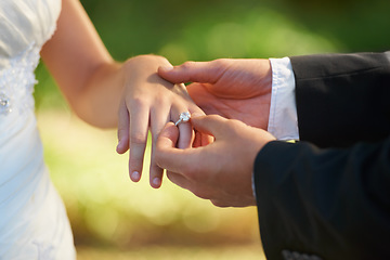 Image showing Closeup, wedding and hands with a ring, love ceremony and commitment with partnership, religious ritual and marriage. Zoom, couple or bride with groom, jewellery or relationship with romance or trust