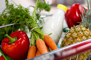 Image showing Food, supermarket and health with grocery in shopping cart for sale, retail and product inflation. Diet, nutrition and economy with fruit produce in store trolley for purchase, consumer and spending