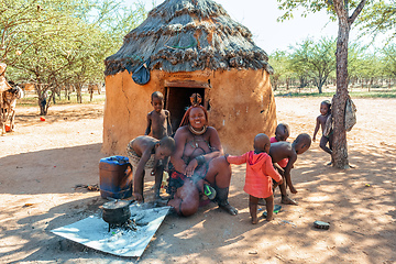 Image showing Himba woman with child in the village