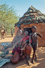 Image showing Himba woman with child in the village