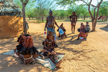 Image showing Himba woman with child in the village