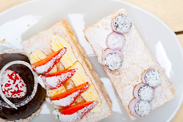 Image showing selection of fresh cream cake dessert plate