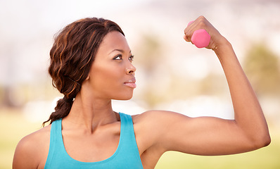 Image showing African woman, dumbbell training and outdoor for focus, strong arm muscle or goal for wellness, Girl, workout and fitness in park, garden or backyard with pride, concentration and health in lifestyle