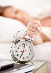 Image showing Snooze, alarm and hand of woman in morning wake up with tired, exhausted and no sleep at home. Depression, sleeping and annoyed female person with anxiety, frustrated and stress hit bedroom clock