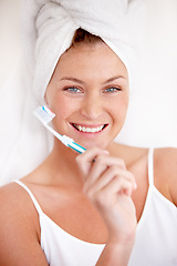 Image showing Portrait, happy woman and brushing teeth with shower towel for healthy dental wellness. Face of female person cleaning mouth with toothbrush, toothpaste and fresh breath of smile, cosmetics and care