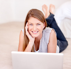 Image showing Happy, laptop and floor with portrait of woman in living room for social media, streaming or website. Search, technology and digital with female user typing at home for connection, email and internet