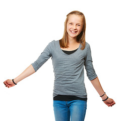 Image showing Studio, portrait and a happy teenage girl for fashion or carefree or pose and standing against a white background. Style, face and young kid smile or child model confident in jeans and shirt