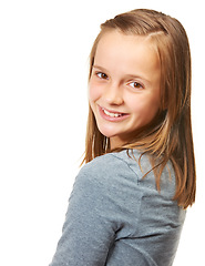 Image showing Portrait, smile and beautiful or happy teenage girl for fashion or carefree and standing against a white background. Style, face and smile or child model or confident youth and isolated in studio