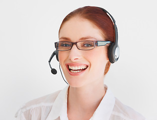 Image showing Call center, happy and portrait of woman in studio for telemarketing, customer service and help desk. Smile, communication and contact us with face of consultant on white background for mockup