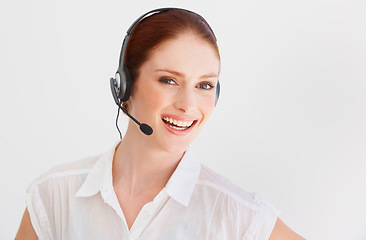 Image showing Call center, communication and portrait of woman in studio for telemarketing, customer service and help desk. Happy, smile and contact with face of consultant isolated on white background for mockup