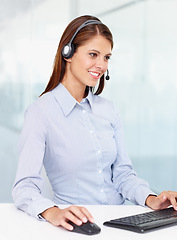 Image showing Happy business woman, call center and computer for consulting, customer service or support at office. Friendly female consultant agent with smile for telemarketing or online advice on PC at workplace