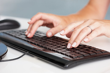 Image showing Hands, typing and closeup of business woman on a computer in office for planning, research and email marketing. Keyboard, fingers and person online for management, proposal and review or report