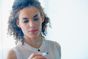 Image showing Serious, business woman and writing schedule for planning, brainstorming or strategy at the office. Focused female employee working on project plan, tasks or coaching on whiteboard at the workplace