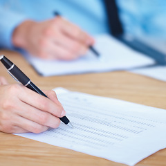 Image showing Business people, hands and writing on finance spreadsheet for accounting, budget or expenses on form. Hand of accountants working on financial report, documents or paperwork with pen on office desk