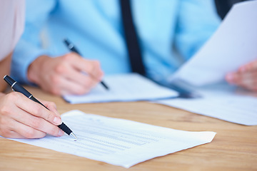 Image showing Business people, hands and writing on spreadsheet for finance paperwork or budget expenses on office desk. Hand of accountant team with financial report, documents or account with pen during audit