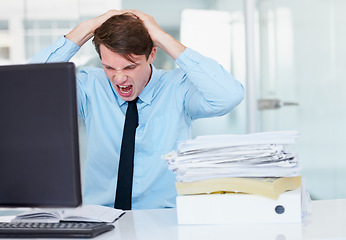 Image showing Stress, shouting and burnout with a business man in his office, sitting at a desk while working on a problem. Audit, tax and anger with a young male employee suffering from deadline pressure at work