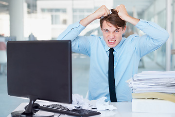 Image showing Portrait, stress or pulling hair with a businessman in an office, feeling anger while working on a problem or crisis. Audit, tax and compliance with a young employee suffering from burnout at work