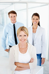 Image showing Portrait, woman leadership and business people with arms crossed for teamwork in office. Collaboration, leader and happy group of employees, man and women, team building and confidence in workplace.