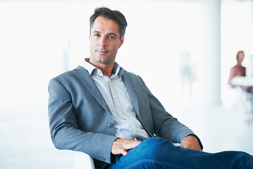 Image showing Portrait, serious and business man on chair in office with pride for career, occupation or job. Professional, male entrepreneur and executive, mature ceo or person from Canada sitting in workplace.