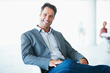 Image showing Portrait, happy and business man on chair in office with pride for career or job. Professional, male entrepreneur and smile of executive, mature ceo or person from Canada sitting in company workplace