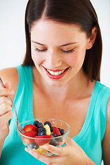 Image showing Happy woman, food and eating a healthy fruit salad with berries, nutrition and health benefits. Face of a female person on nutritionist diet with vegan meal for weight loss, wellness or detox