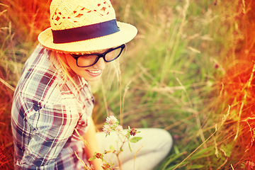 Image showing Summer, countryside and woman with lens flare in field for freedom, wellness and happiness outdoors. Nature, flowers and female person in natural meadow for relaxing, calm and peaceful in morning