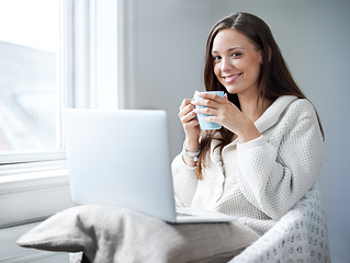 Image showing Woman, coffee and happy in portrait with laptop, studying or social media in home office. Girl, student and computer with tea cup, relax and happiness for learning, education or future with smile