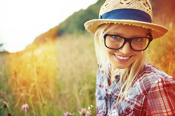 Image showing Lens flare, countryside and portrait of happy woman in field for freedom, wellness and sustainability outdoor. Nature, summer and face of hipster person in meadow with glasses, fashion and style