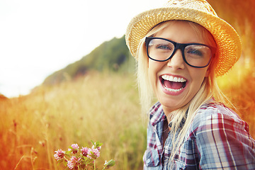 Image showing Happy, countryside and face of woman laugh in field for freedom, wellness and fresh air outdoor. Nature, hipster and portrait of person in meadow with lens flare for relaxing and sustainability