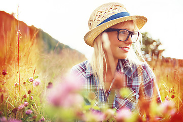 Image showing Thinking, countryside and woman with lens flare in field for freedom, wellness and fresh air outdoors. Nature, hipster and female person in natural meadow for relaxing, calm and peace in morning