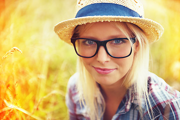 Image showing Lens flare, nature and portrait of woman in countryside for freedom, wellness and fresh air outdoors. Hipster, summer and face of female person in meadow field for relaxing, calm and peace in morning