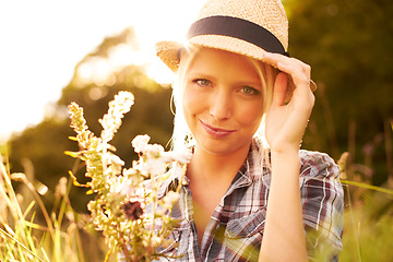 Image showing Lens flare, countryside and portrait of woman with flower in field for freedom, wellness and relax outdoors. Nature, summer and hipster female person smile in meadow for sustainability and ecology