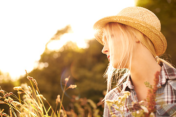 Image showing Thinking, countryside and woman in field with sunrise for freedom, wellness and fresh air outdoors. Nature, summer and hipster female person in natural meadow for sustainability and ecology