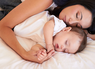 Image showing Baby, sleeping and mother holding hands on bed with parent support, care and love. Relax, home and child sleep with mom in a house feeling tired and sleepy with mama rest with kid dreaming together