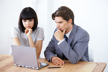 Image showing Business people, laptop and thinking in meeting for strategy, planning or brainstorming decision at the office. Thoughtful businessman or woman wondering in team project plan on computer at workplace