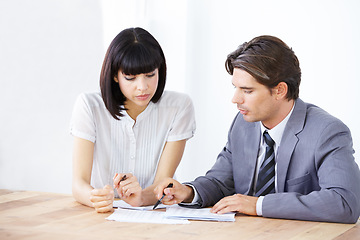 Image showing Business people, analysis of paperwork in meeting, team in office conference room and collaboration. Data analyst employees working together, man and woman with teamwork and review corporate document