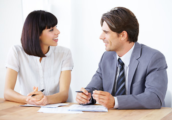 Image showing Happy business people, documents and collaboration in finance, partnership or team strategy on office desk. Businessman and woman smiling for teamwork, financial paperwork or spreadsheet at workplace