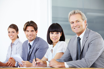 Image showing Portrait, teamwork and a group of business people sitting in the boardroom for a planning meeting. Collaboration, strategy or training with corporate men and women working together in the office