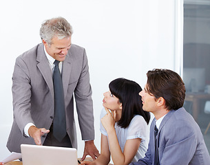 Image showing Mentor, coaching and laptop with business people in office for planning, idea and project management. Training, consulting and technology with ceo and employees for teamwork, leadership and meeting