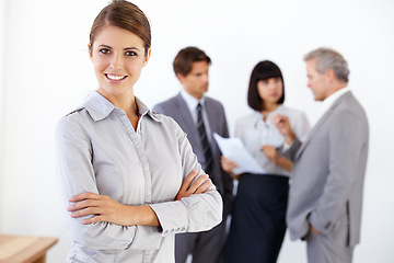 Image showing Business woman, portrait smile and arms crossed in meeting for leadership or team management at office. Happy female entrepreneur manager smiling in confidence for teamwork collaboration at workplace