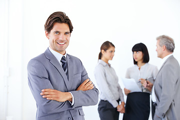 Image showing Businessman, portrait smile and arms crossed in meeting for leadership or team management at office. Happy man, boss or manager smiling in confidence for teamwork or collaboration at workplace