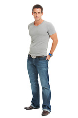 Image showing Serious young man, portrait in a studio with casual fashion and confidence with pride. White background, tshirt and modern guy style of male person, isolated, proud and confident, stylish model