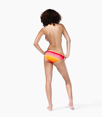 Image showing Black woman, rear view and bikini for in studio for summer, vacation and fun while posing on white background space. Model, swimwear and back of girl standing confident, proud and cool while isolated